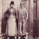 Unidentified couple on stilts